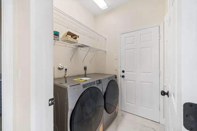 a utility room with dryer and washer