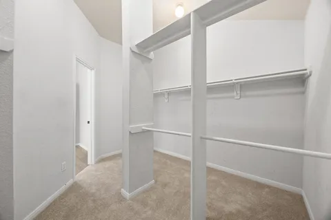 a view of an empty walk in closet
