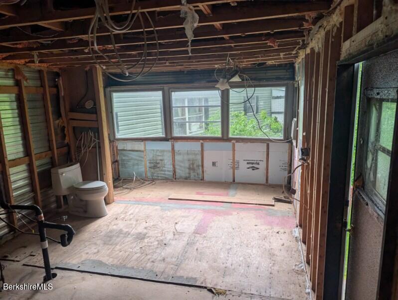 155 Water Street, Unit 5 Lee, MA 01238 - Photo 3 of 6 a view of an empty room with a window