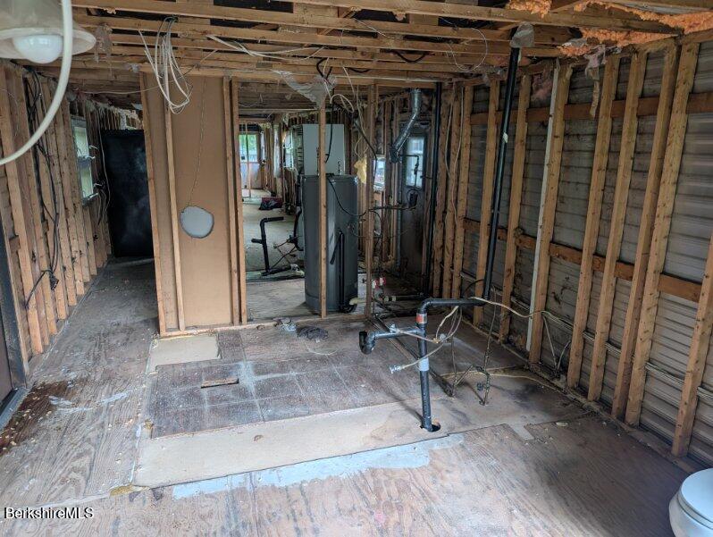 155 Water Street, Unit 5 Lee, MA 01238 - Photo 4 of 6 a view of a porch with a table and chairs