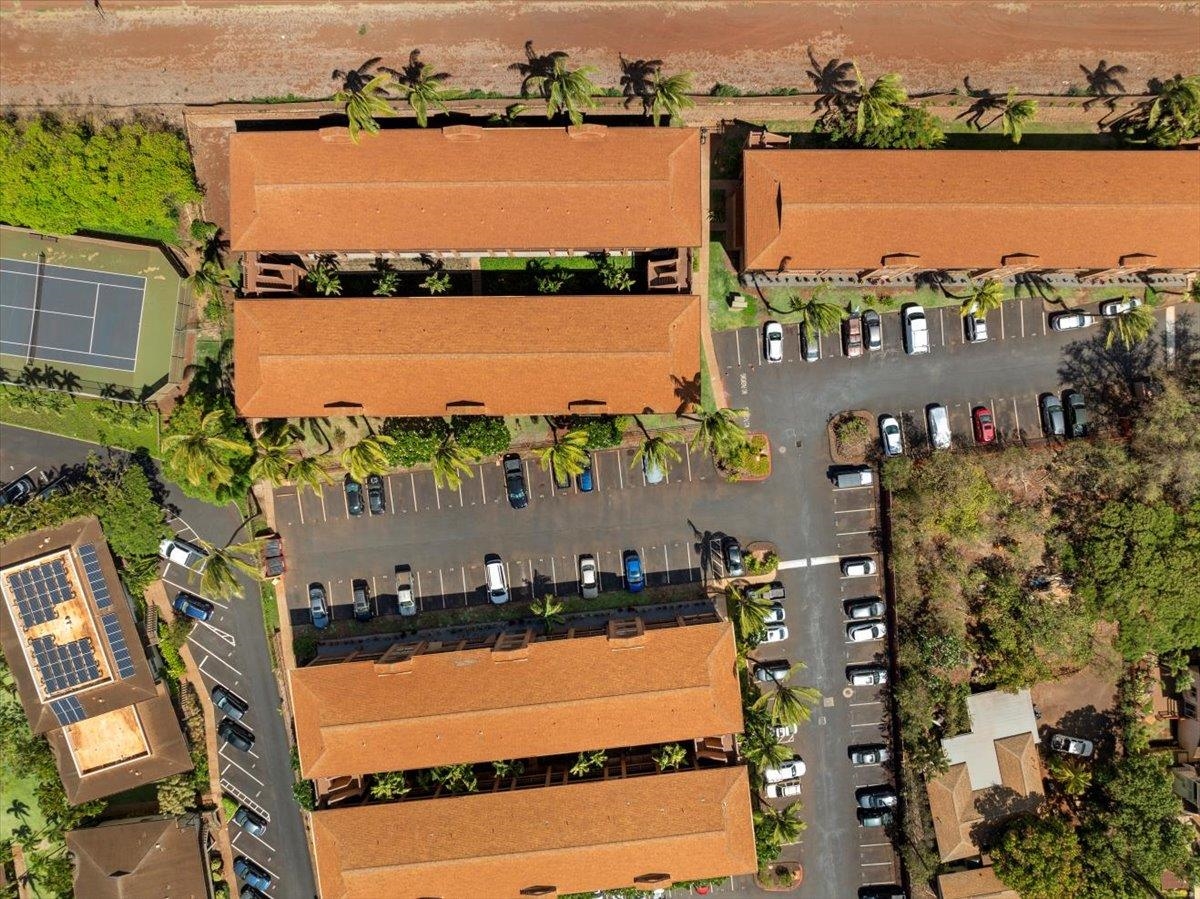 3740 Lower Honoapiilani Road, Unit E102 Lahaina, HI 96761 - Photo 13 of 41 an aerial view of ocean and residential houses with outdoor space