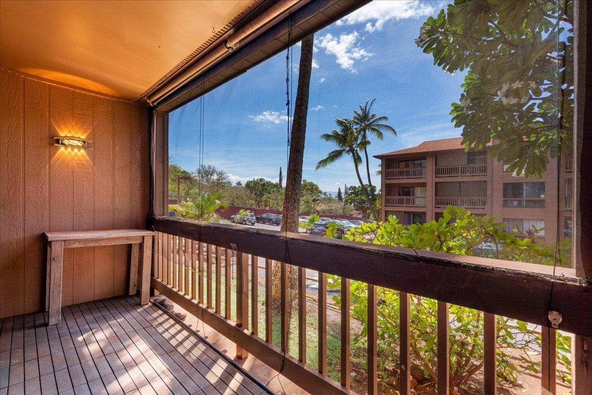 3740 Lower Honoapiilani Road, Unit E102 Lahaina, HI 96761 - Photo 30 of 41 a view of a balcony with wooden floor