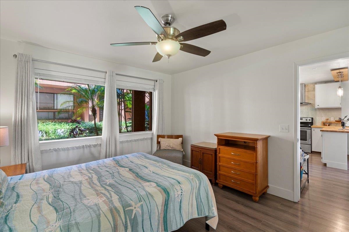 3740 Lower Honoapiilani Road, Unit E102 Lahaina, HI 96761 - Photo 36 of 41 a bedroom with a large bed and a large window