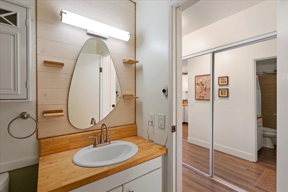3740 Lower Honoapiilani Road, Unit E102 Lahaina, HI 96761 - Photo 37 of 41 a bathroom with a sink double vanity and shower