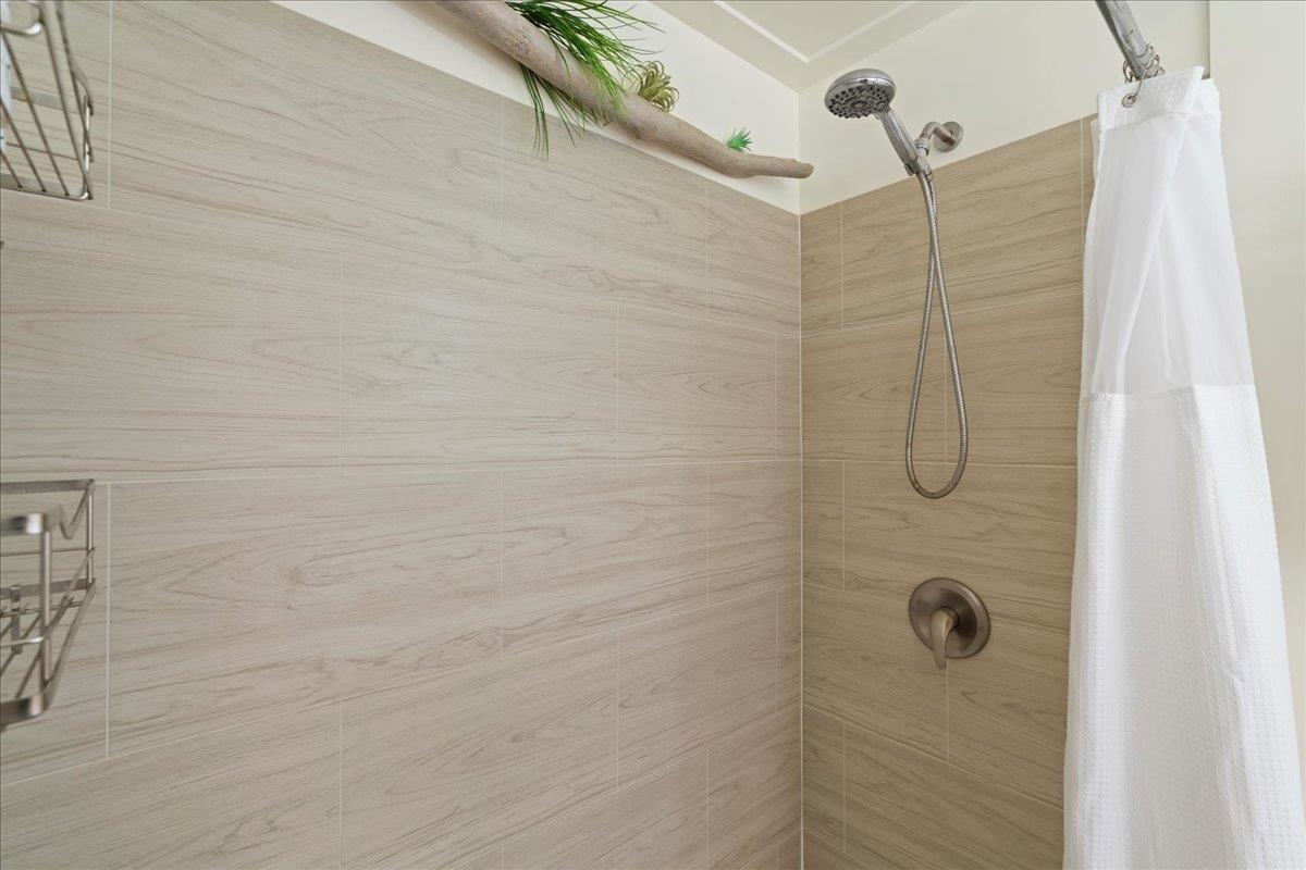 3740 Lower Honoapiilani Road, Unit E102 Lahaina, HI 96761 - Photo 39 of 41 a bathroom with a shower