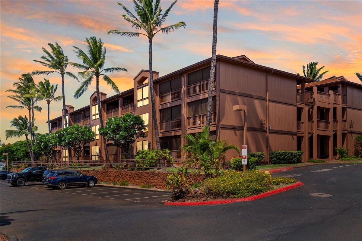 3740 Lower Honoapiilani Road, Unit E102 Lahaina, HI 96761 - Photo 5 of 41 a view of a street with a cars park in front of it