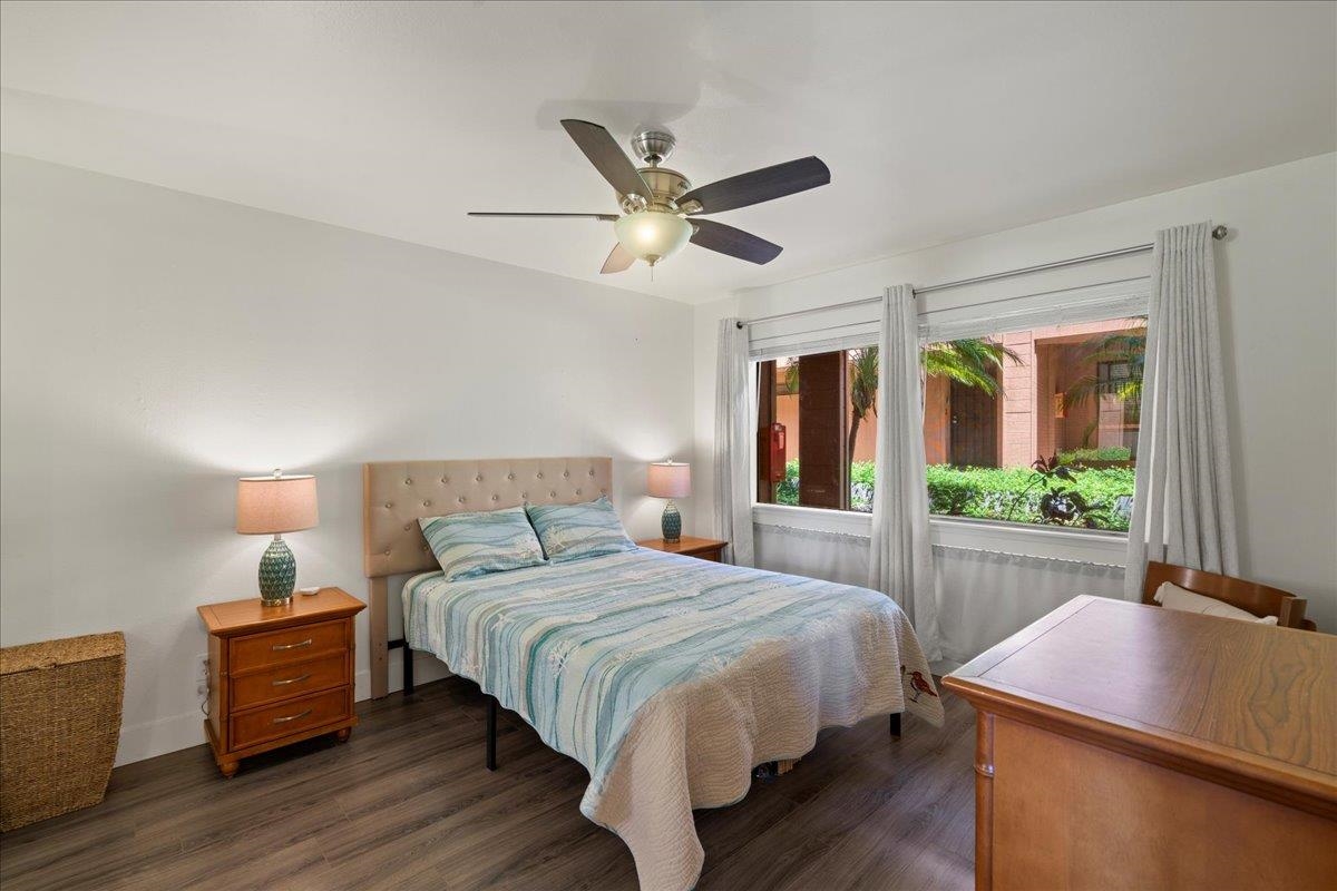 3740 Lower Honoapiilani Road, Unit E102 Lahaina, HI 96761 - Photo 6 of 41 a bedroom with a bed and a large window