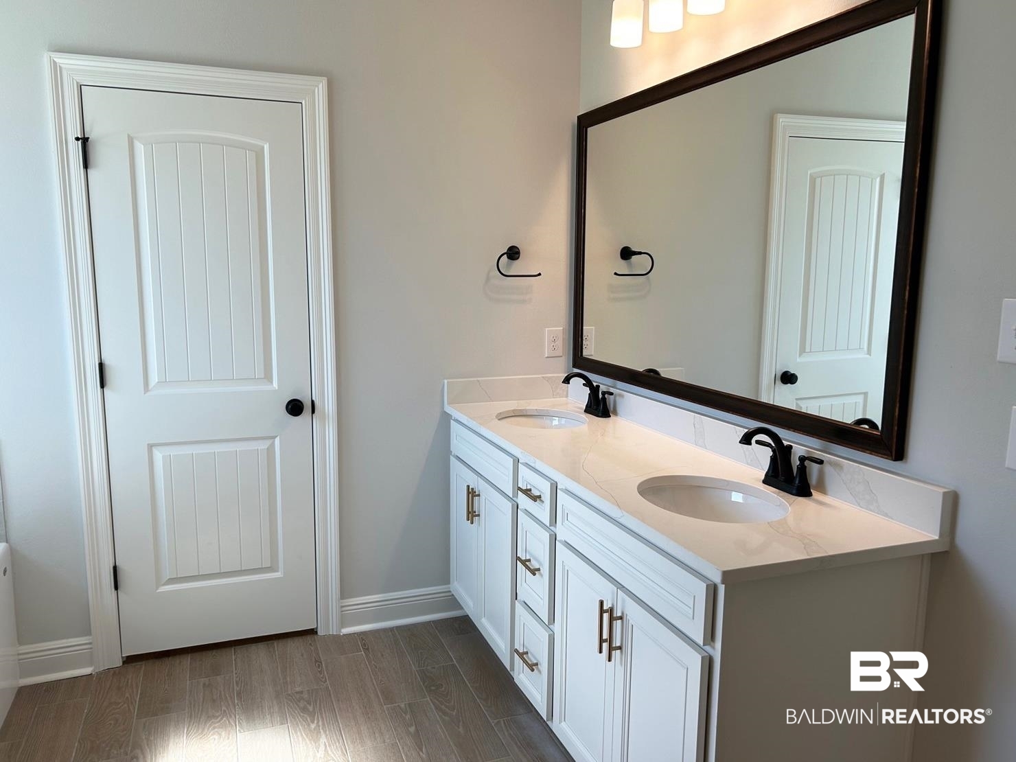 884 Sumter Loop Foley, AL 36535 - Photo 9 of 18 Bathroom featuring vanity and wood-type flooring