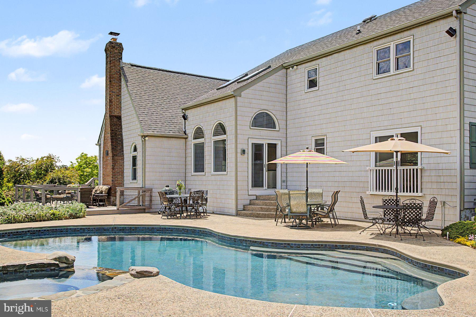 4009 Smoke Road Doylestown, PA 18902 - Photo 47 of 52 a view of a house with pool and chairs