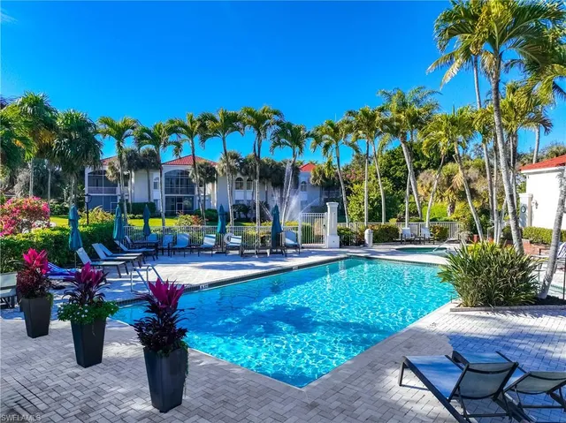 a view of a swimming pool with a patio