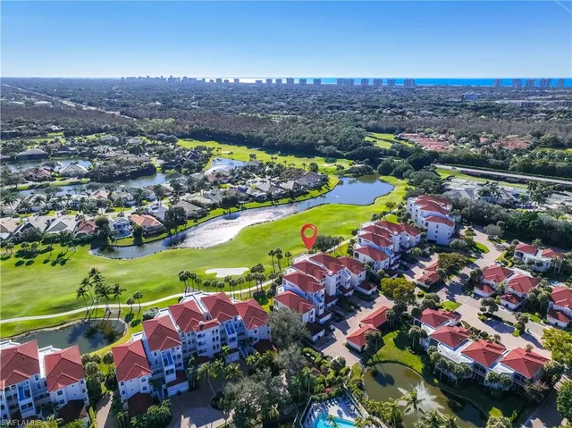 an aerial view of a houses and an outdoor space