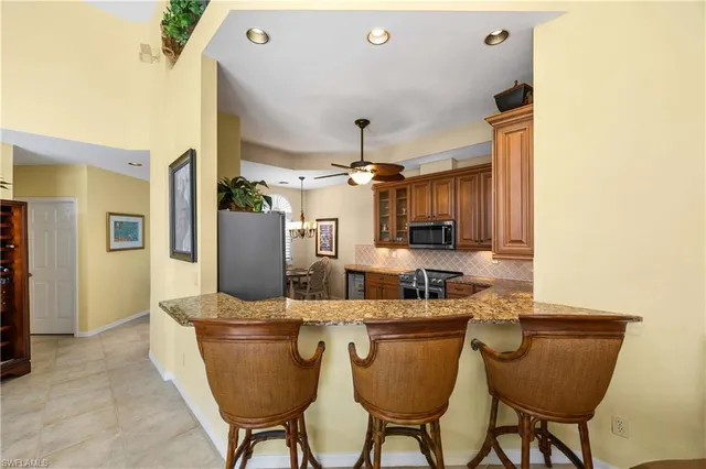 a dining room with furniture and chandelier