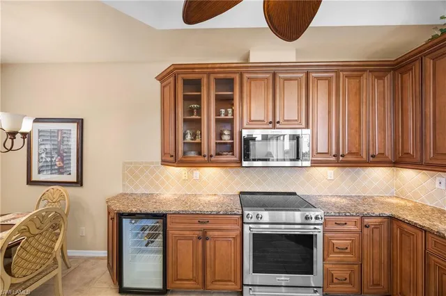 a kitchen with stainless steel appliances granite countertop a stove and a sink