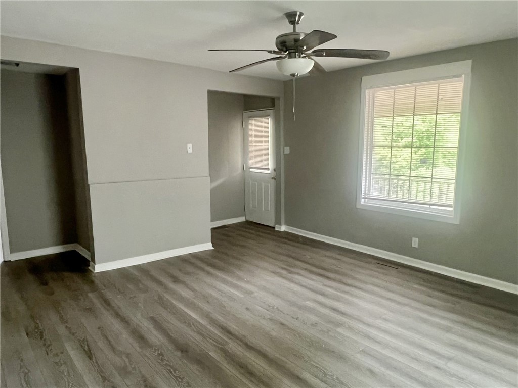 301 Hammett Street Honea Path, SC 29654 - Photo 3 of 14 This living area features durable flooring and ample natural light, ideal for everyday living.