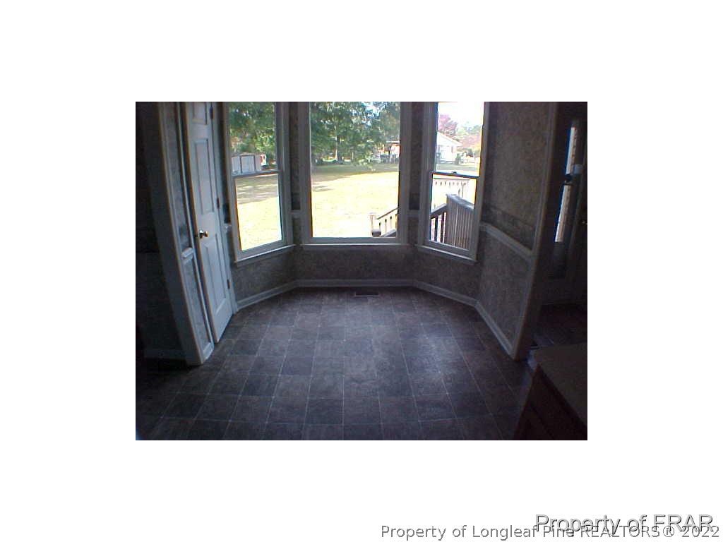 4546 Legion Road Hope Mills, NC 28348 - Photo 6 of 11 a view of an empty room with a window