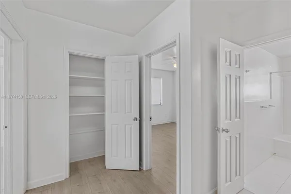 a view of an empty room with a window