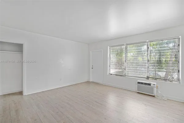 a view of empty room with a fireplace