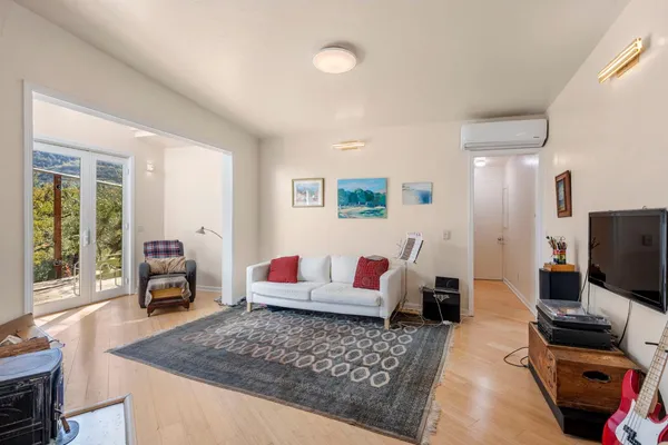 a dining room with furniture and a window