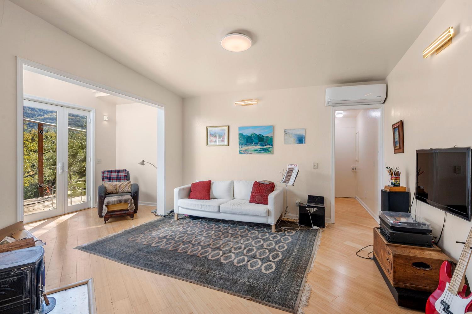 7123 Swiss Ranch Road Mountain Ranch, CA 95246 - Photo 15 of 66 a living room with furniture and a flat screen tv