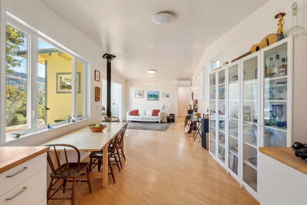 a kitchen with granite countertop cabinets stainless steel appliances and a window