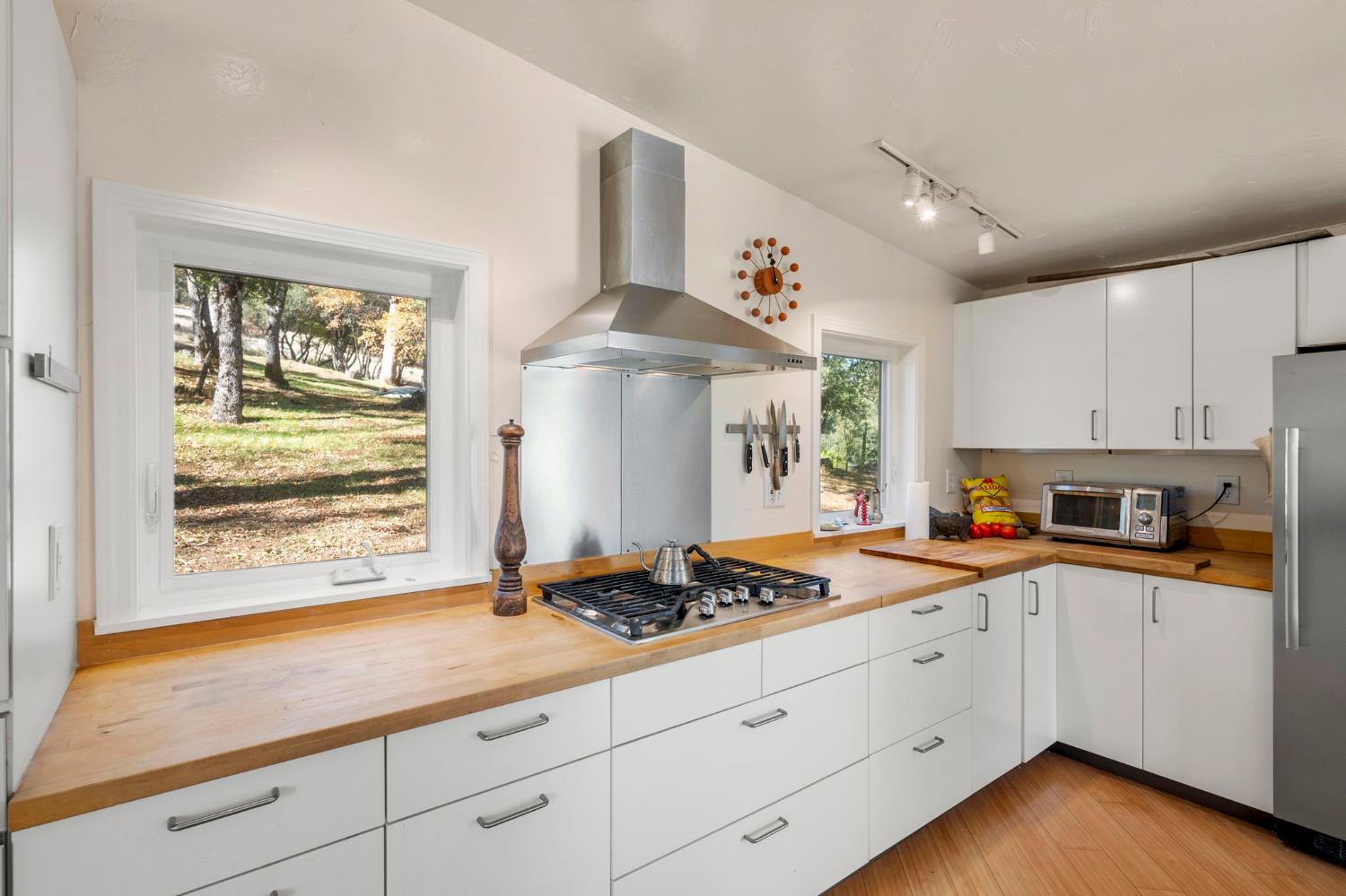 7123 Swiss Ranch Road Mountain Ranch, CA 95246 - Photo 23 of 66 a kitchen with granite countertop cabinets stainless steel appliances and a window