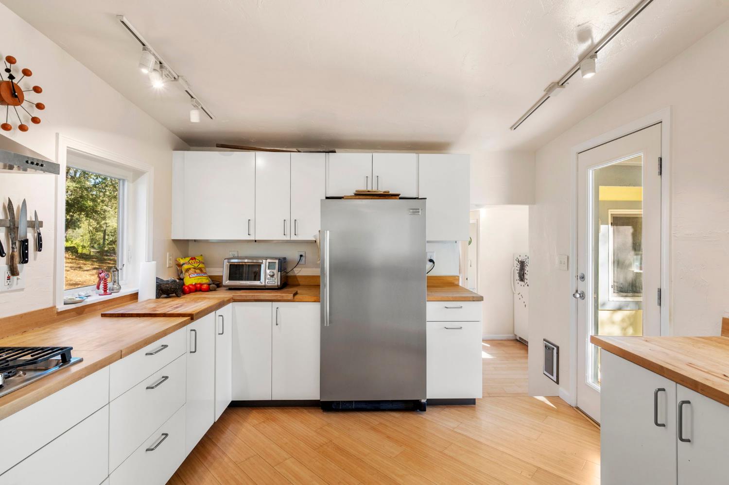 7123 Swiss Ranch Road Mountain Ranch, CA 95246 - Photo 24 of 66 a kitchen with stainless steel appliances a refrigerator sink and cabinets