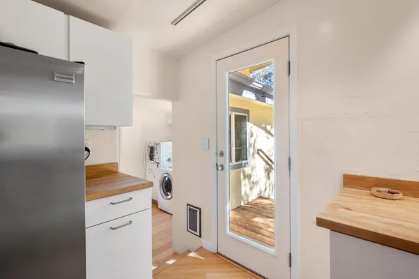 a bathroom with a granite countertop toilet a sink and a mirror