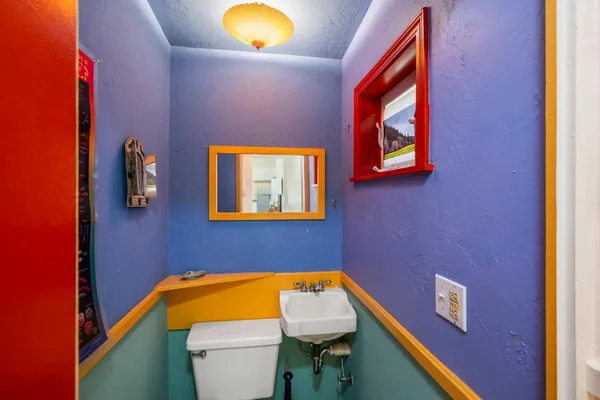 a view of a storage and utility room with washer and dryer