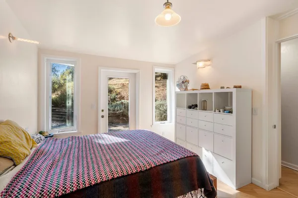 a bedroom with a bed and a window