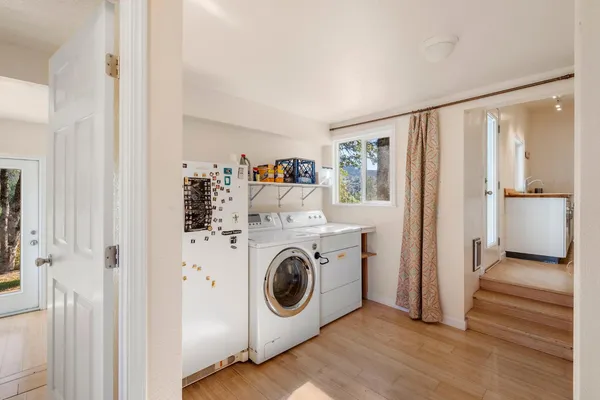 a view of a livingroom with furniture and a workspace
