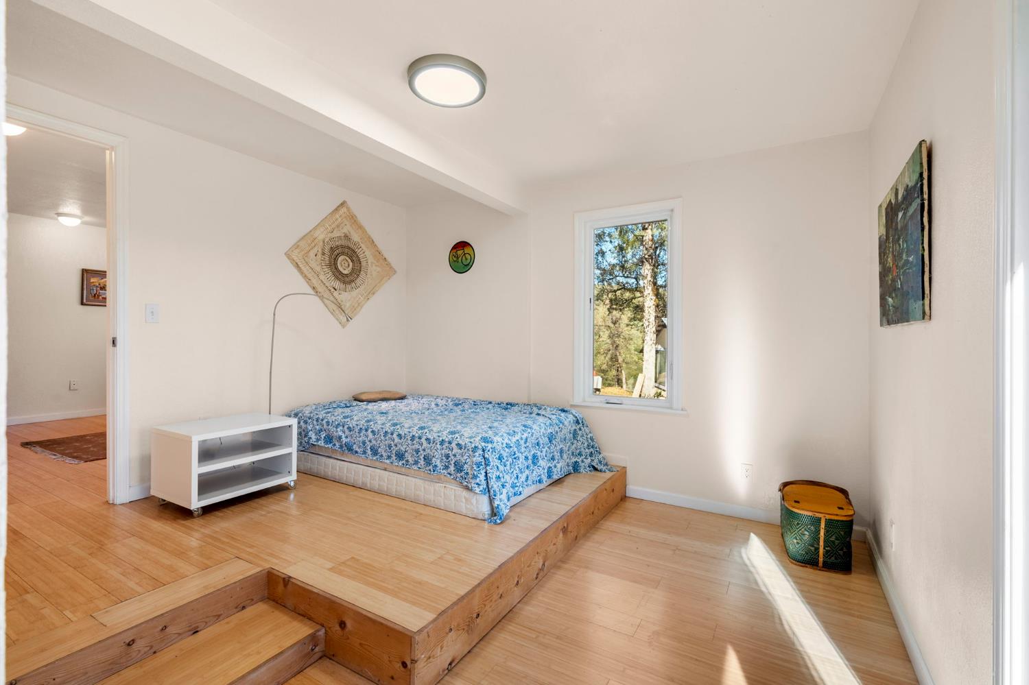 7123 Swiss Ranch Road Mountain Ranch, CA 95246 - Photo 39 of 66 a bedroom with a bed and a window