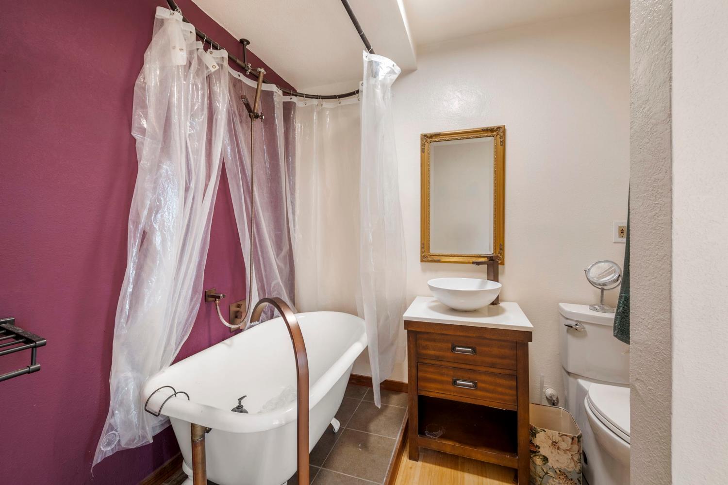 7123 Swiss Ranch Road Mountain Ranch, CA 95246 - Photo 41 of 66 a bedroom with a bed and a mirror