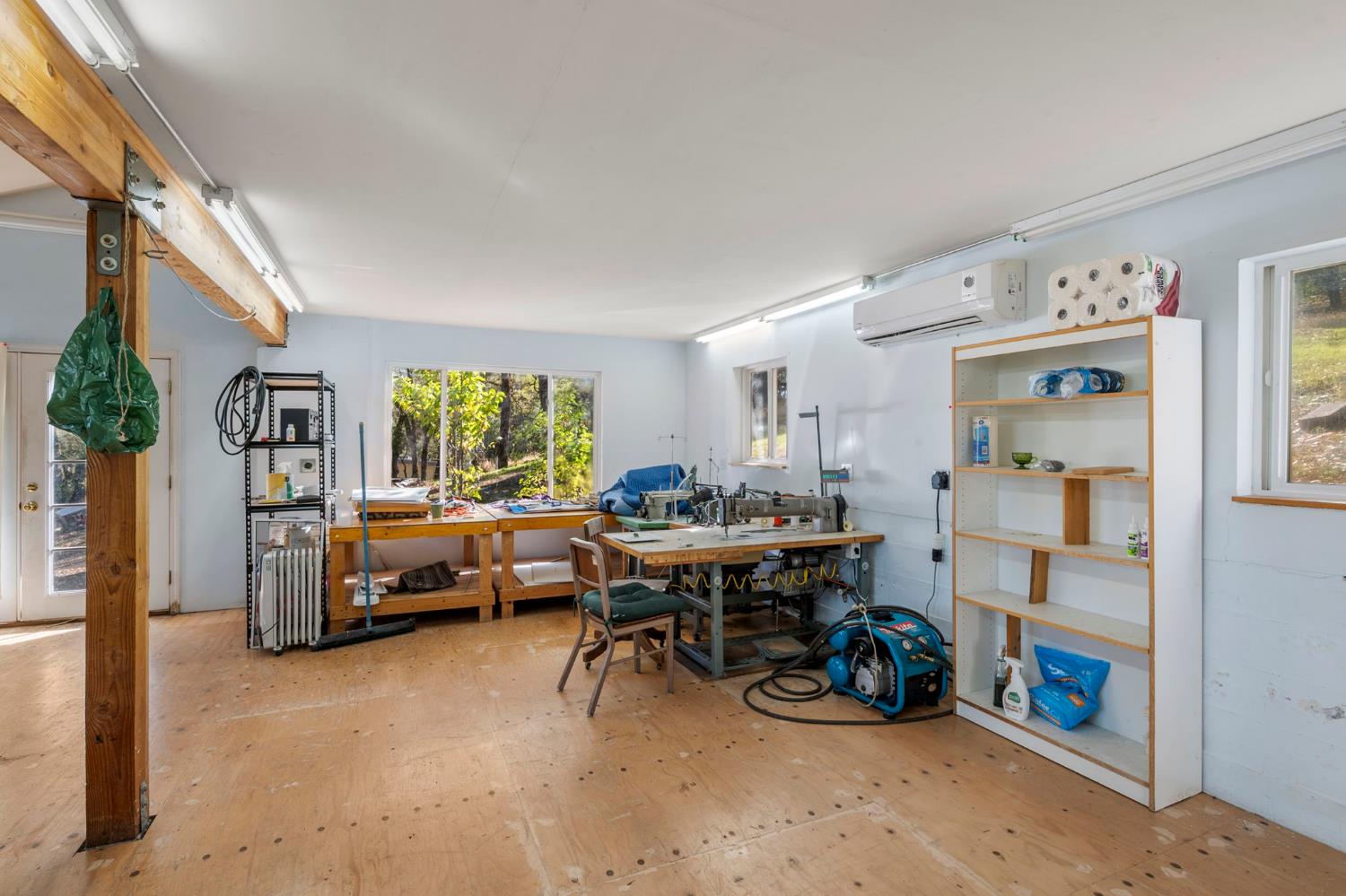 7123 Swiss Ranch Road Mountain Ranch, CA 95246 - Photo 46 of 66 a living room with furniture and a dining table with chairs