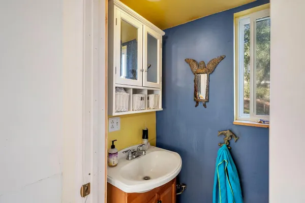 a backyard of a house with table and chairs