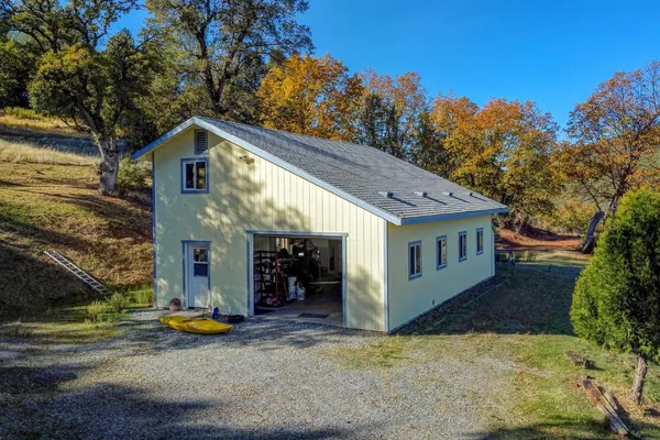 a view of a yard with swimming pool
