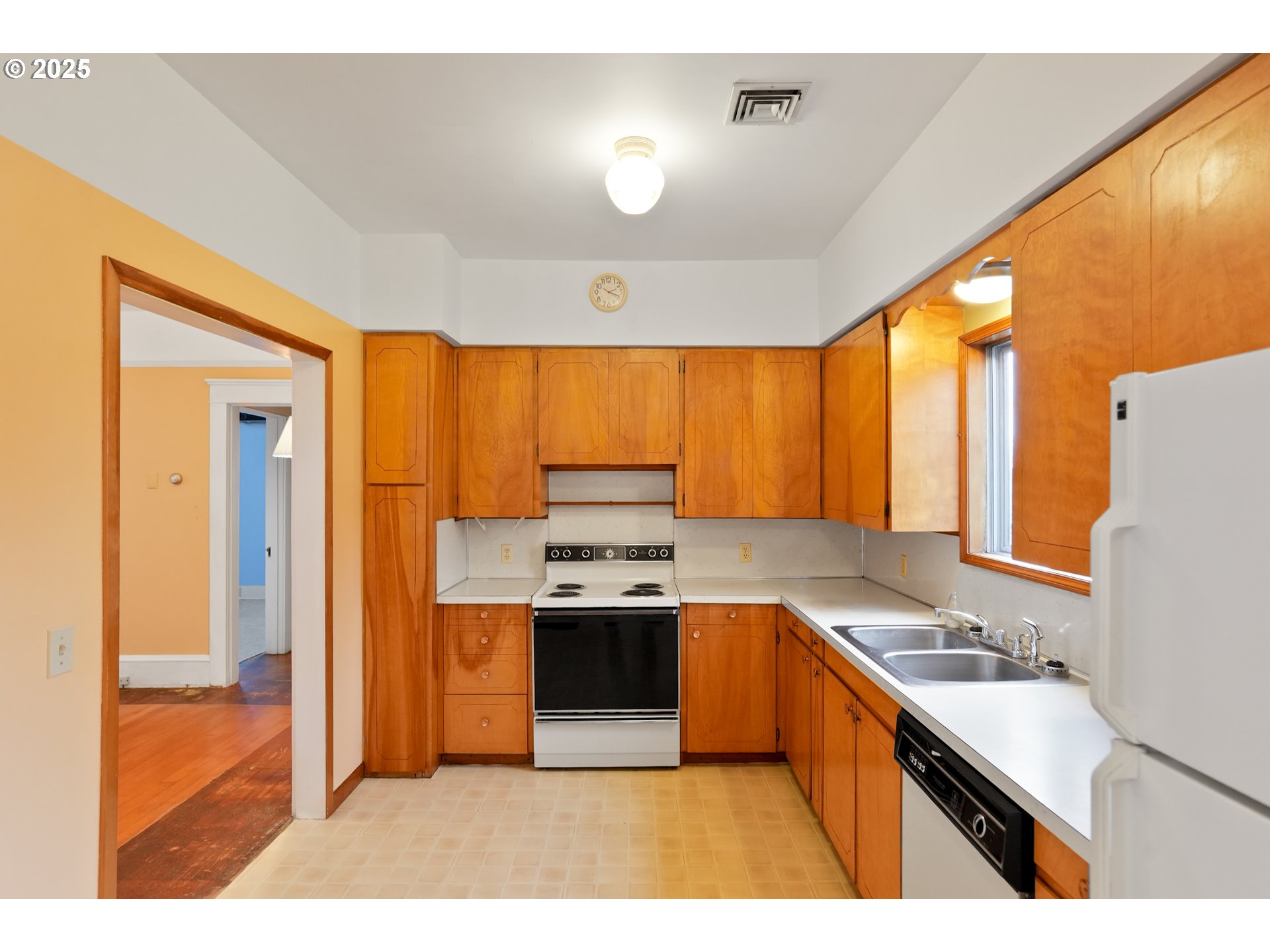 619 B Street Silverton, OR 97381 - Photo 20 of 42 a kitchen with stainless steel appliances granite countertop a sink stove and refrigerator