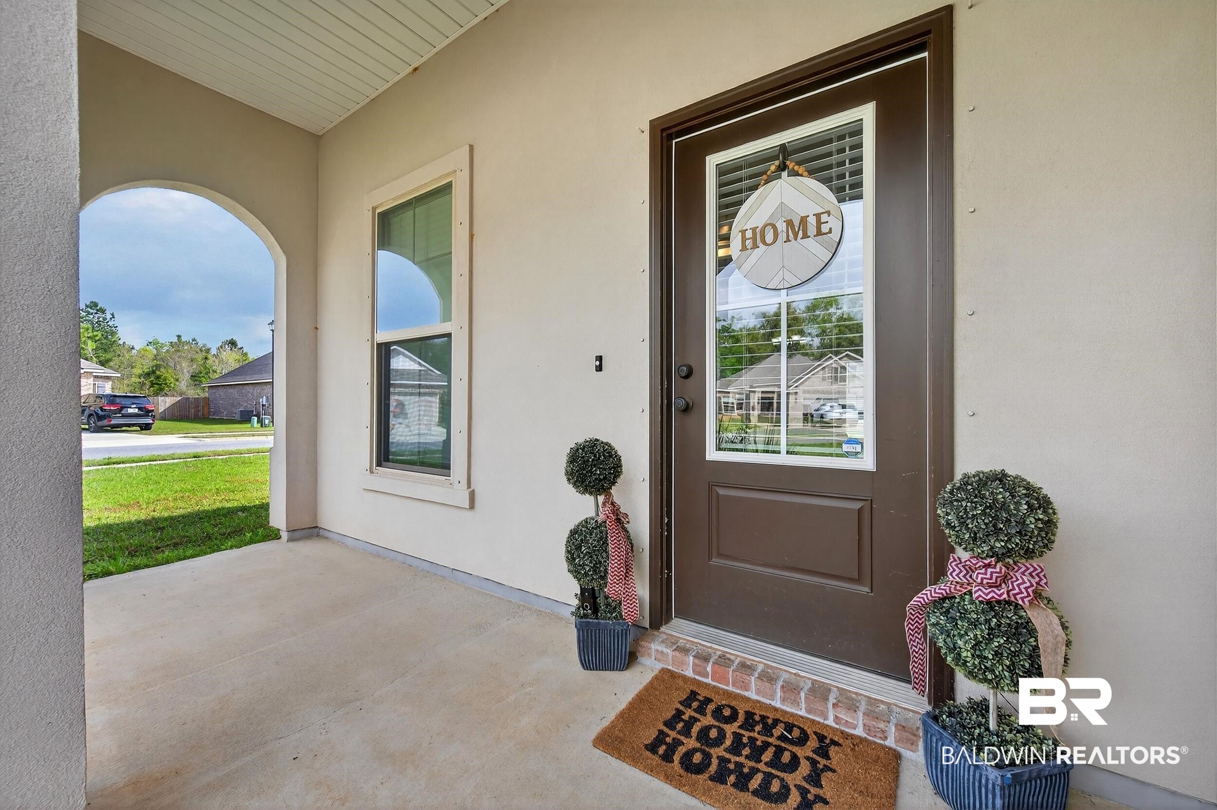 1084 Stella Road Foley, AL 36535 - Photo 4 of 31 Doorway to property featuring a porch and stucco siding