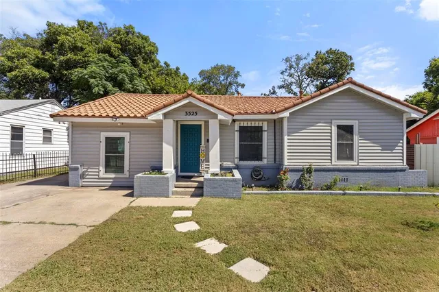 a front view of a house with swimming pool and porch