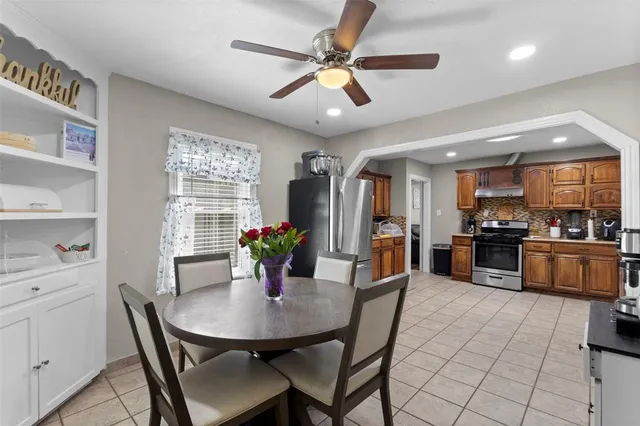 a view of a dining room with furniture and a livingroom