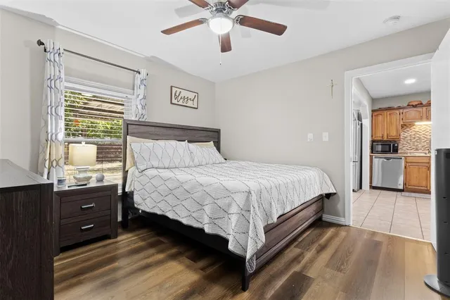 a bedroom with a bed and window