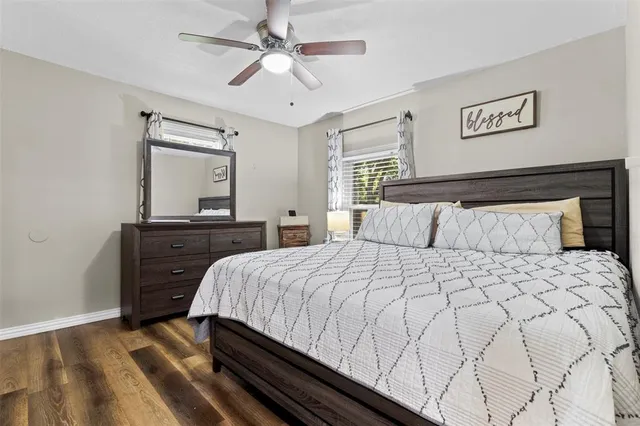 a bedroom with a bed and a dresser