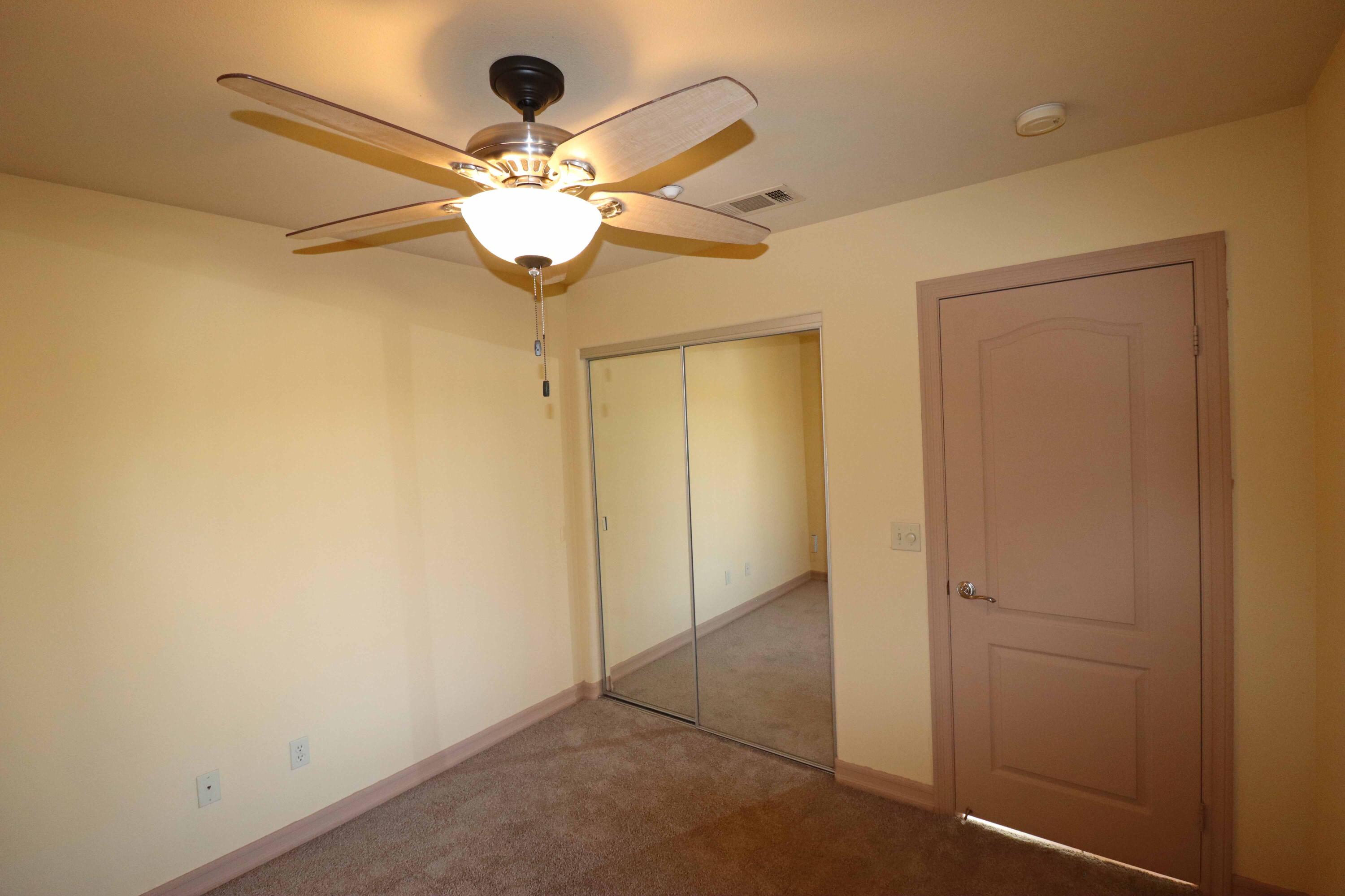 7201 Demesne Road Joshua Tree, CA 92252 - Photo 18 of 27 a view of a chandelier fan and closet in a room