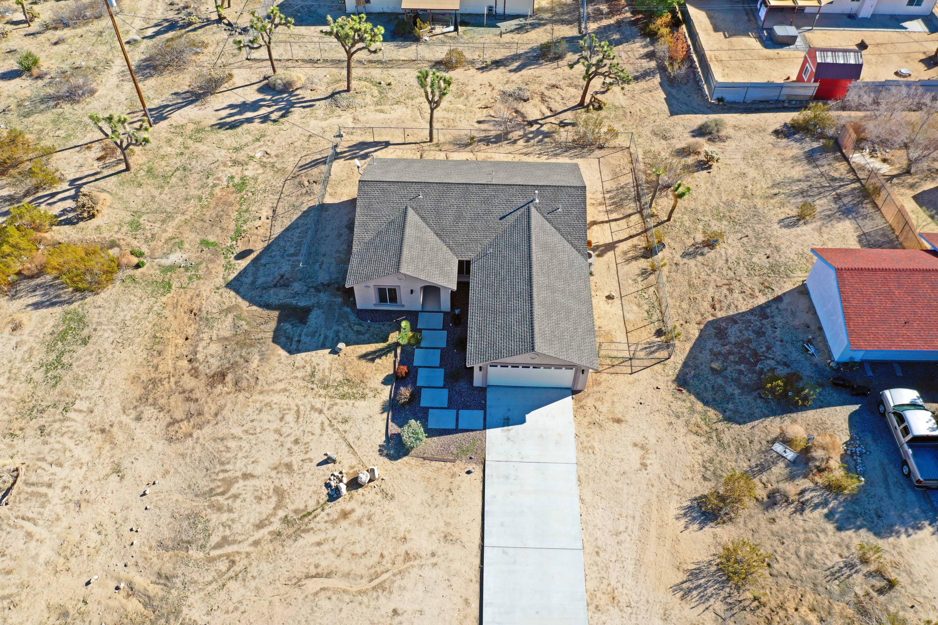 7201 Demesne Road Joshua Tree, CA 92252 - Photo 26 of 27 a aerial view of a house with large trees