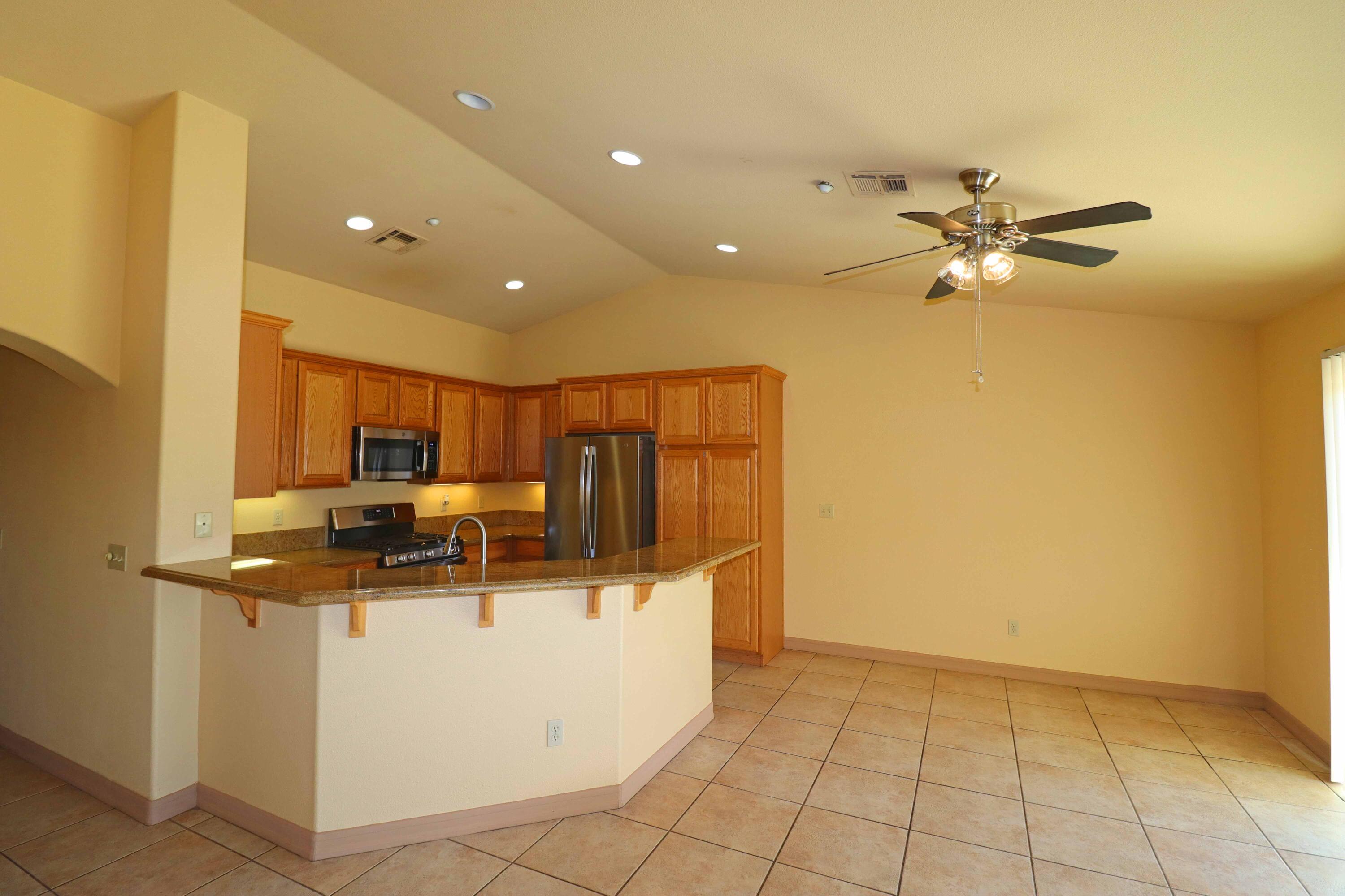 7201 Demesne Road Joshua Tree, CA 92252 - Photo 6 of 27 a kitchen with stainless steel appliances a refrigerator a stove a sink and dishwasher