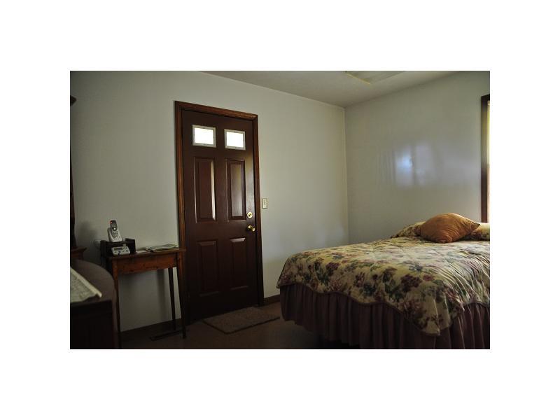 110 Wansack Road West Middlesex, PA 16159 - Photo 12 of 20 Bedroom. BEDROOM WITH POWDER ROOM AND ACCESS TO COVERED PORCH