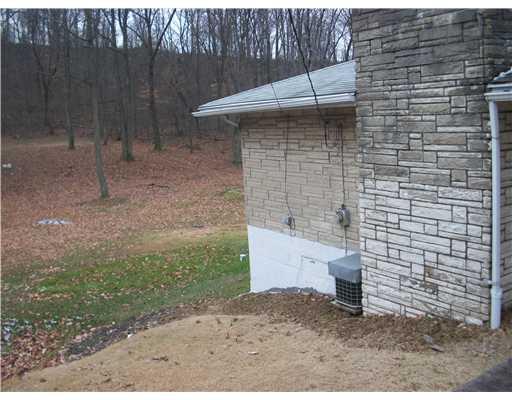 149 Rydle Road Mount Pleasant, PA 15666 - Photo 3 of 18 Exterior Front. Left side of home recently waterproofed inc re-direction of water from parking area.