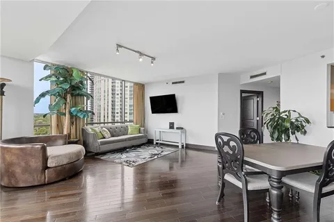 a view of a livingroom with furniture and a flat screen tv