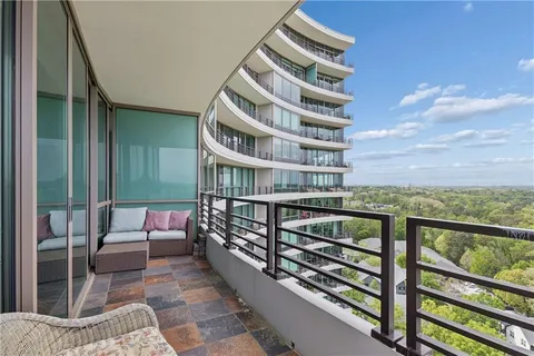 a view of balcony with furniture