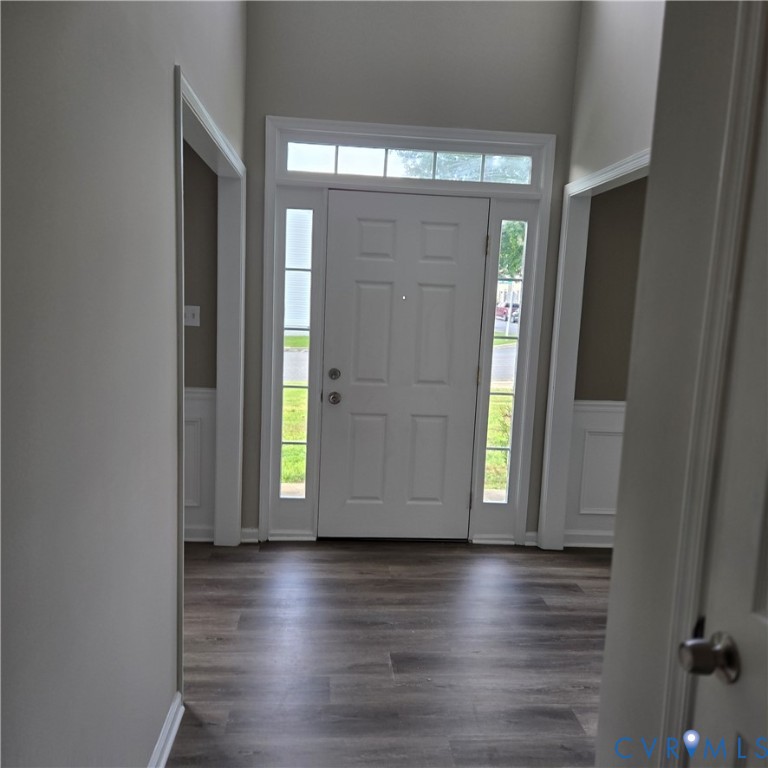Entryway featuring a paneled door with sidelights