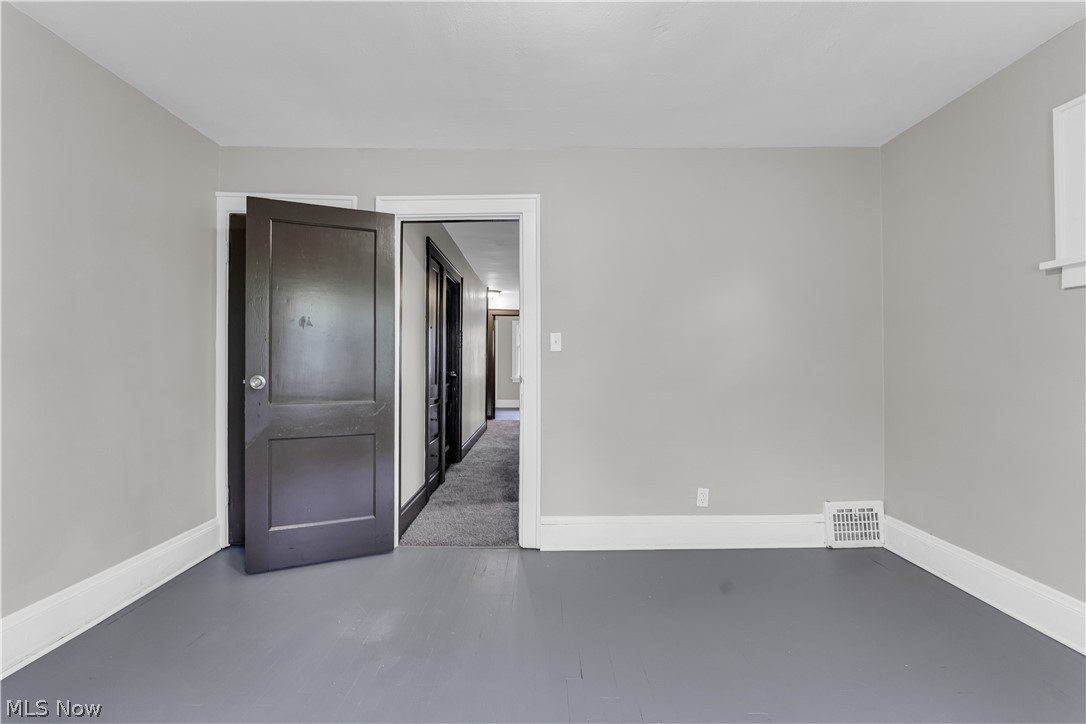 1144 East 145th Street, Unit 1/RIGHT Cleveland, OH 44110 - Photo 16 of 20 Neutral wall paint and painted flooring create a versatile interior